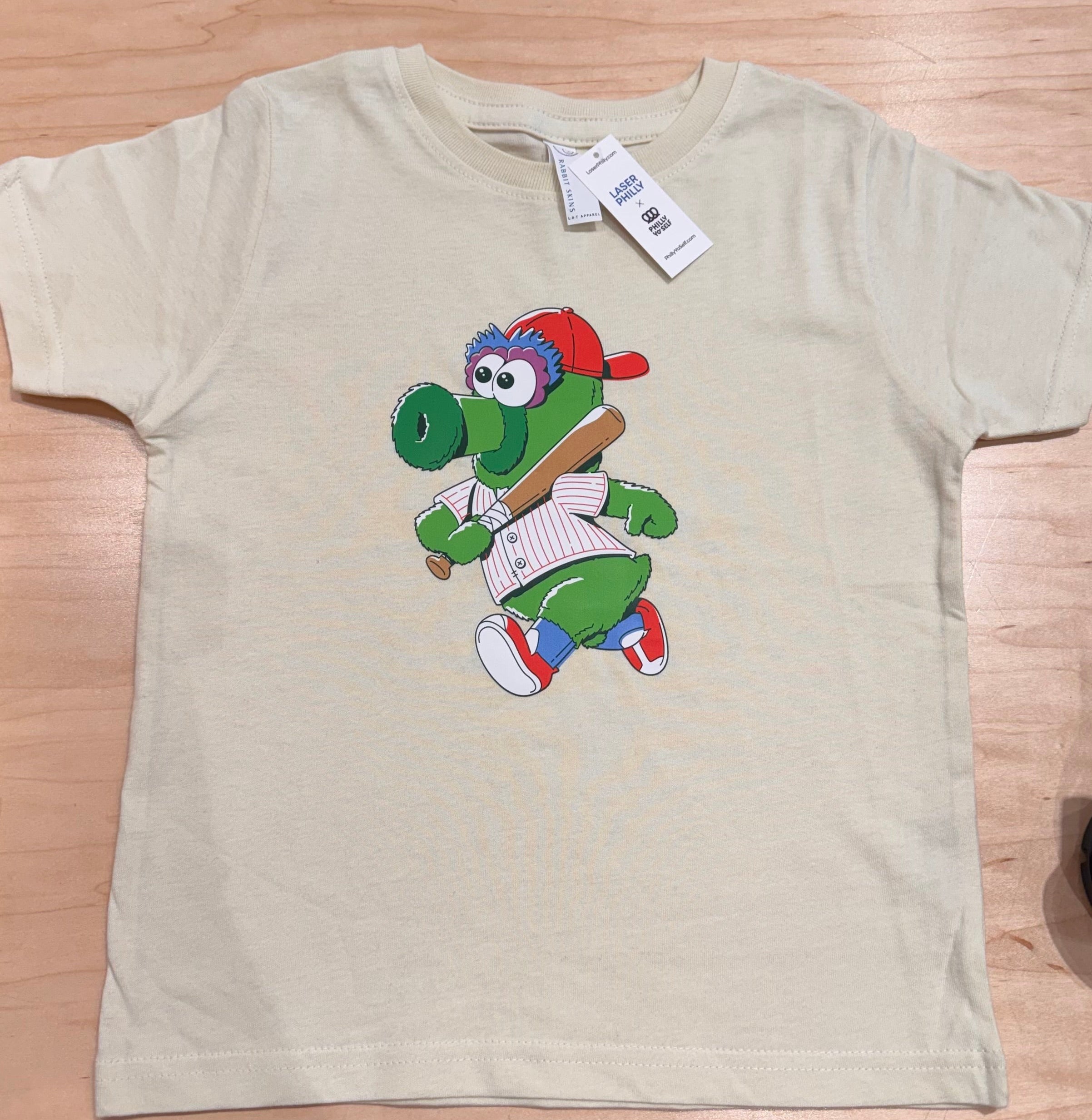 Philadelphia Phillies Phanatic Mascot as a little kid wearing a red and white striped jersey. Little Phan is front and center on this Toddler Tee that comes in sizes 2,3 and 4.