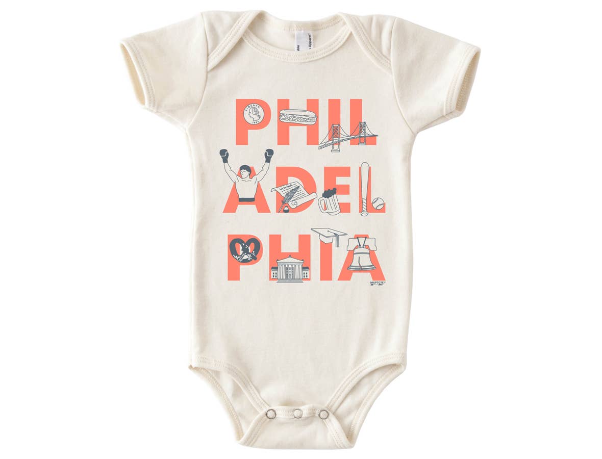 Bold Orange Philadelphia Font 3-6 month onesie. Illustrated coin, cheesesteak, Benjamin Franklin Bridge, Rocky statue, declaration of independence, pint of beer, baseball and baseball bat, soft pretzel, Independence mall, graduation cap, and the liberty bell. Designed and printed by Maptote. 